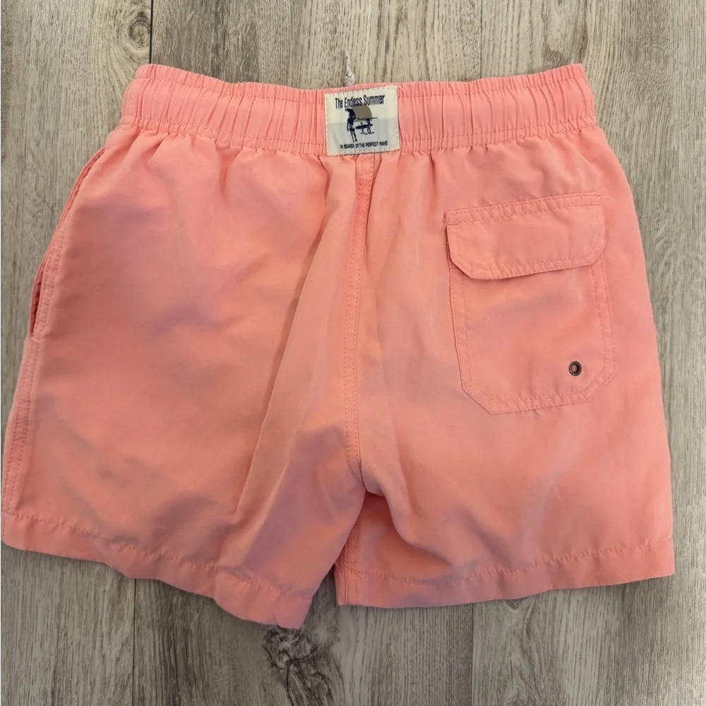 The Endless Summer Kids Swim Trunks in Orange pink color